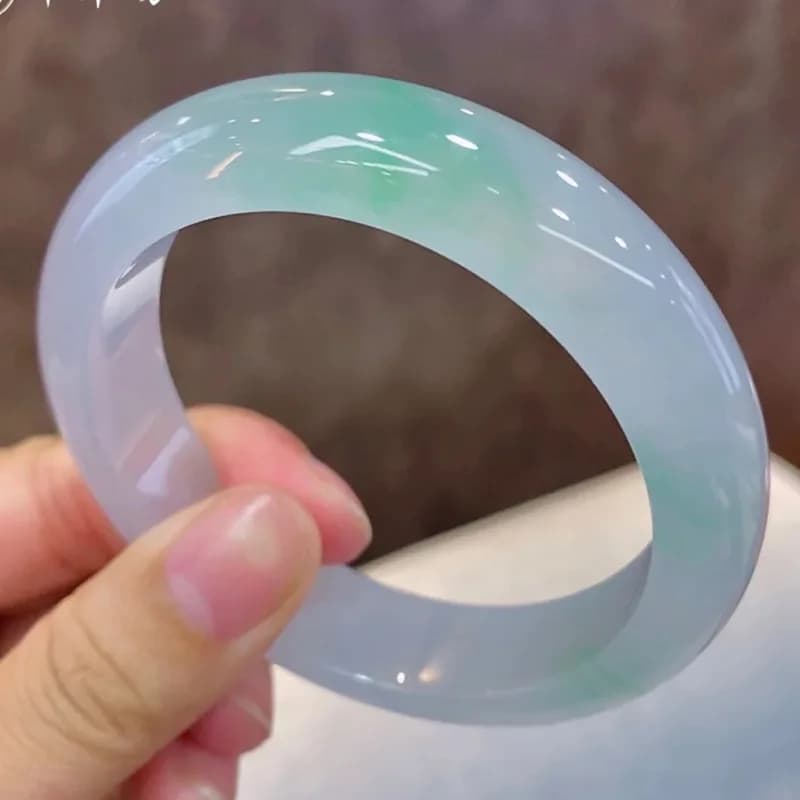 Natural bracelet, ice-like texture, dark with floating patterns, light sun-green jade