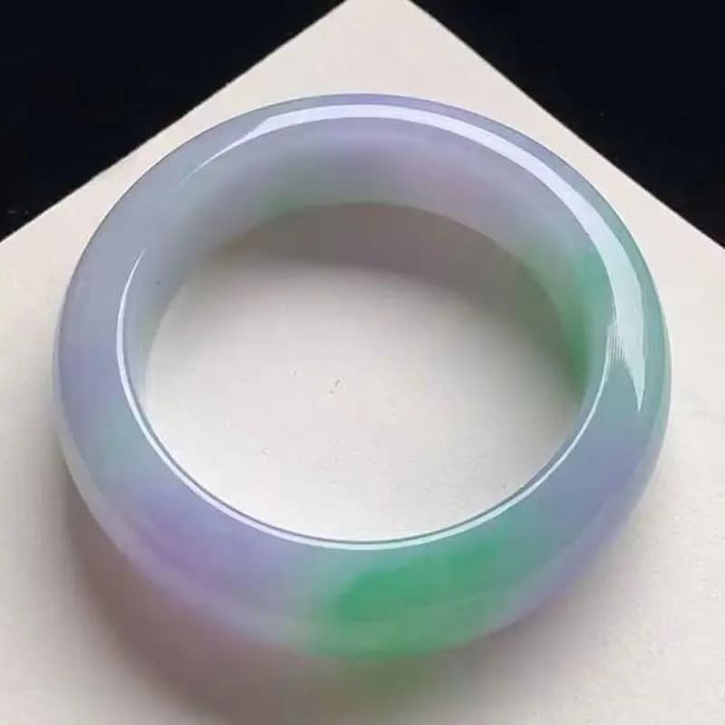 Ice-like, spring-colored, vibrant jade bracelet with purple and green hues